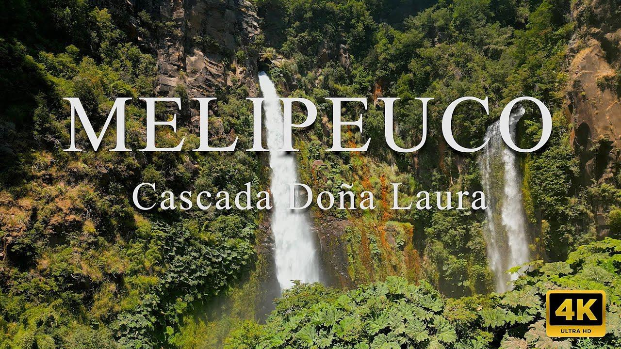 Waterfall surrounded by vegetation at Doña Laura